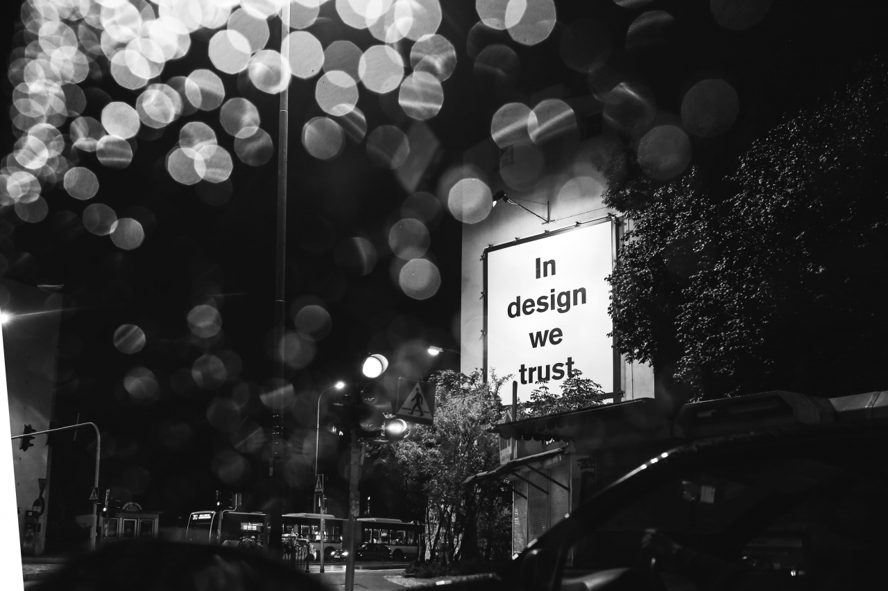 kaboompics Black and white huge design billboard through a wet car window